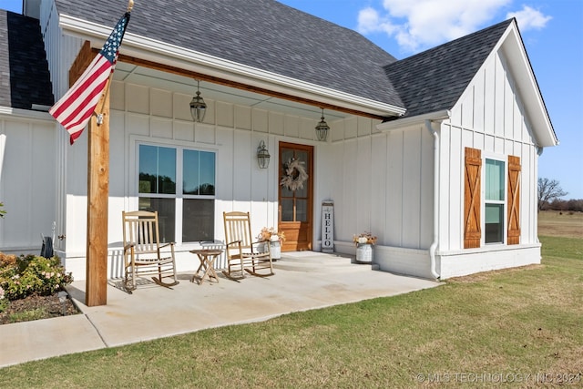 exterior space with a lawn and covered porch