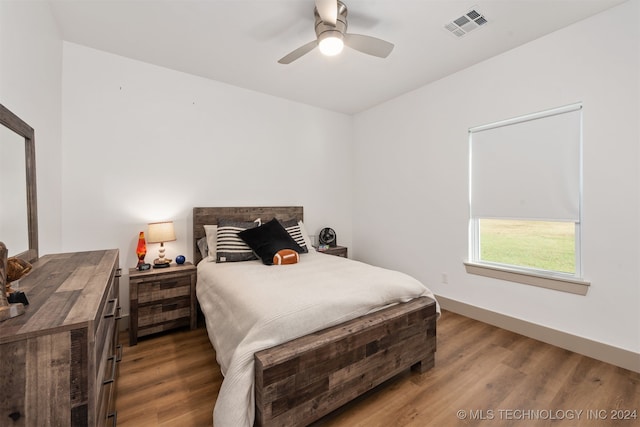 bedroom featuring wood-type flooring and ceiling fan