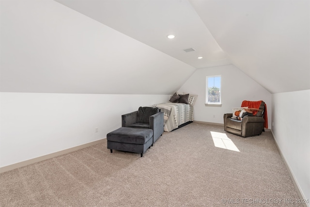 carpeted bedroom featuring lofted ceiling