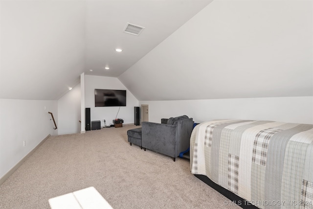 carpeted bedroom featuring lofted ceiling