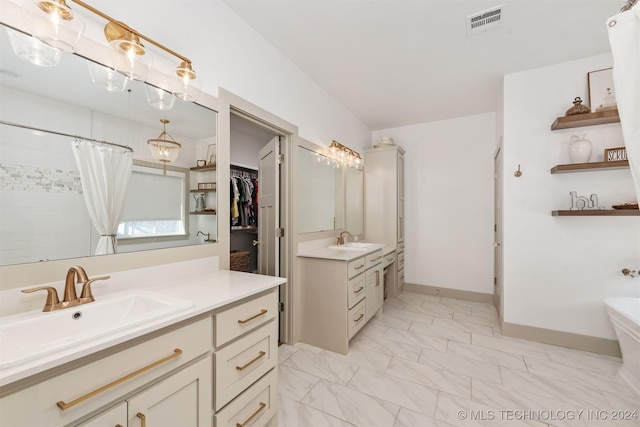 bathroom featuring a shower with shower curtain and vanity