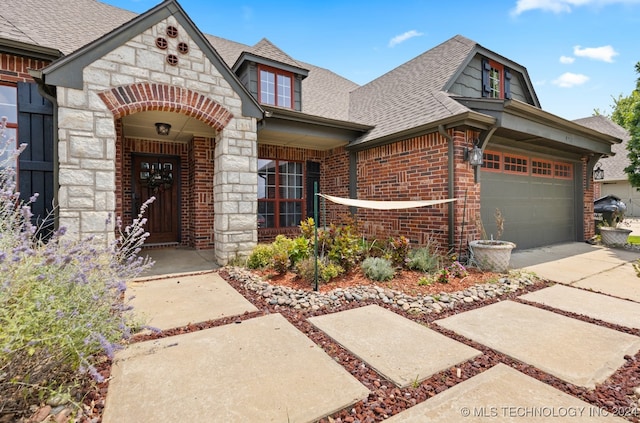 view of front of property with a garage