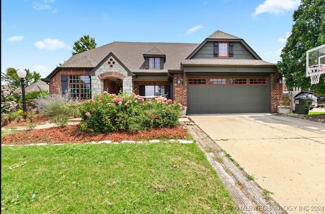 view of front facade featuring a front yard and a garage