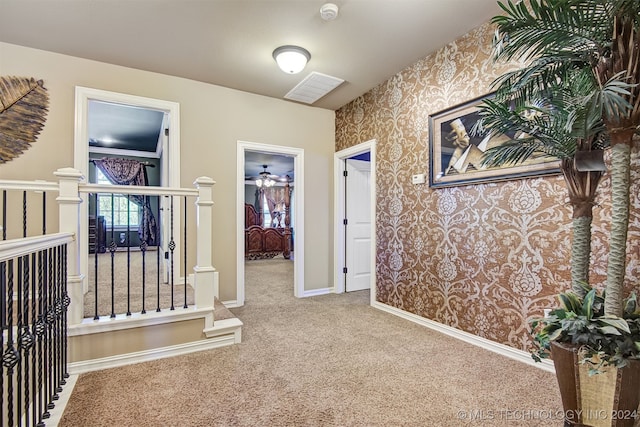 corridor with carpet floors