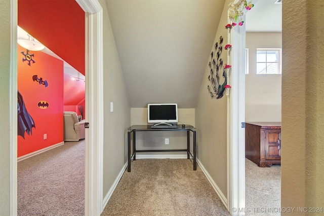 office area featuring lofted ceiling and light colored carpet