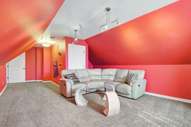 carpeted living room featuring lofted ceiling