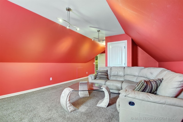 carpeted living room featuring track lighting and vaulted ceiling