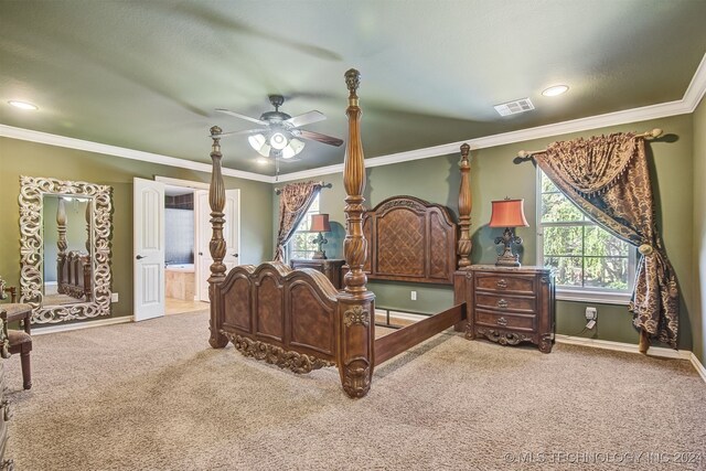 bedroom featuring ensuite bathroom, carpet, ornamental molding, and ceiling fan