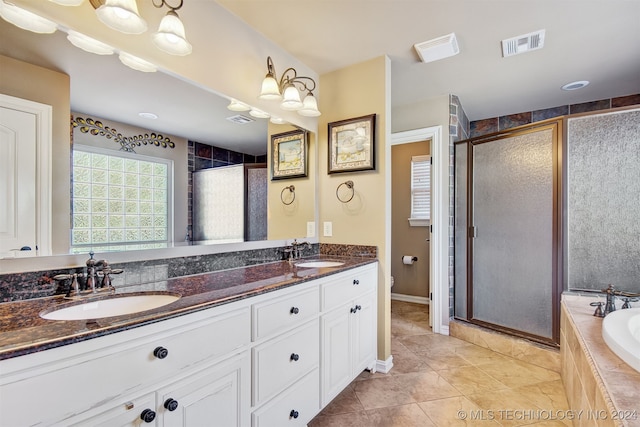 bathroom with vanity, tile patterned floors, and independent shower and bath