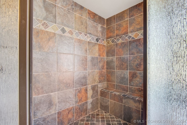 details with a tile shower