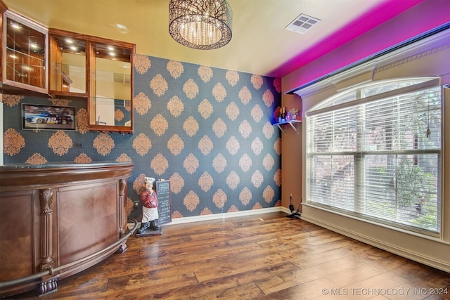 interior space with a healthy amount of sunlight and hardwood / wood-style floors