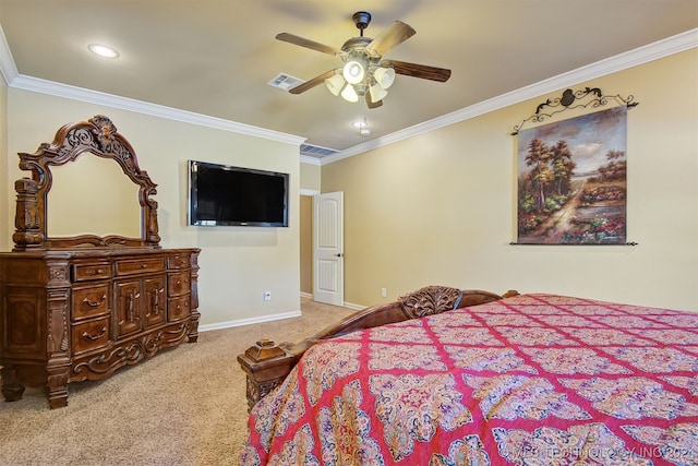 carpeted bedroom featuring ceiling fan and ornamental molding