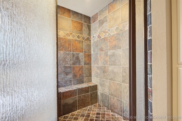 bathroom featuring tiled shower