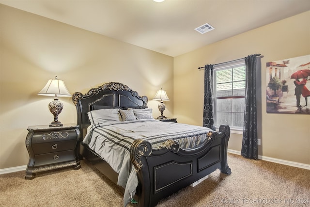 bedroom with light carpet