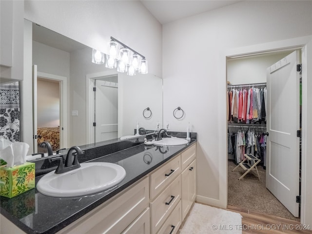 bathroom with vanity and hardwood / wood-style flooring