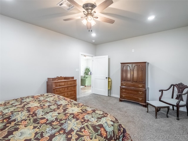 bedroom with ceiling fan and light carpet