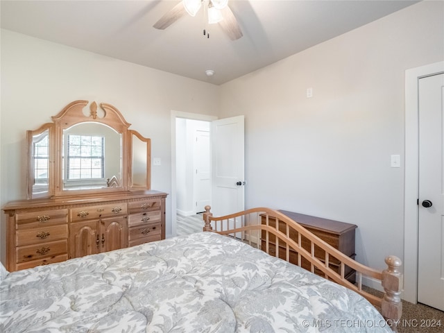 carpeted bedroom featuring ceiling fan