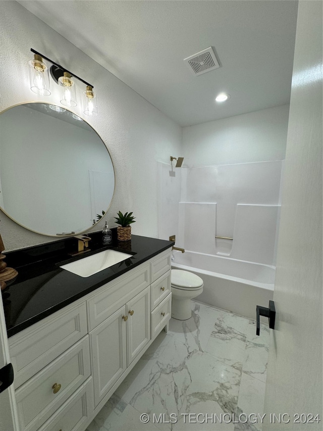 full bathroom with vanity, shower / washtub combination, and toilet