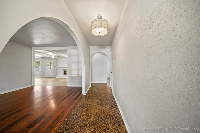 hallway with dark hardwood / wood-style floors