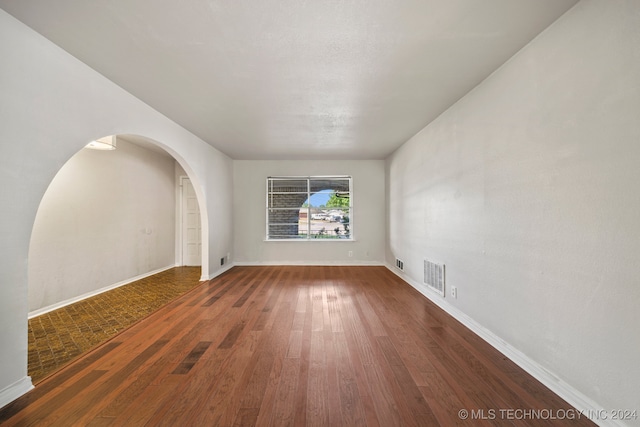 unfurnished room featuring hardwood / wood-style floors