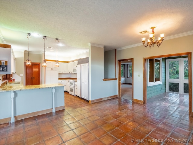 kitchen featuring ornamental molding, white cabinets, decorative light fixtures, and white appliances