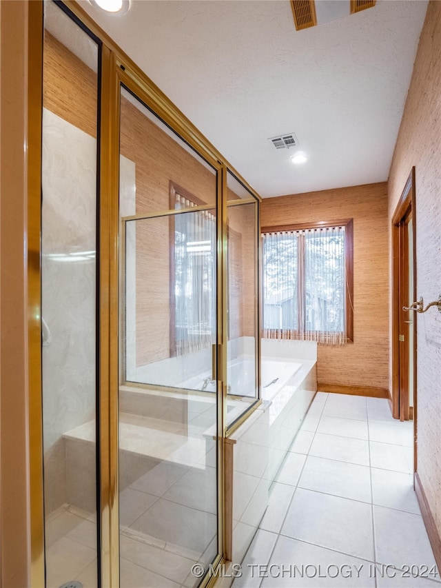 bathroom featuring tile patterned floors and plus walk in shower