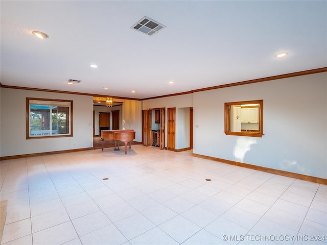 unfurnished living room featuring ornamental molding