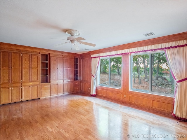 unfurnished living room featuring light hardwood / wood-style floors and ceiling fan