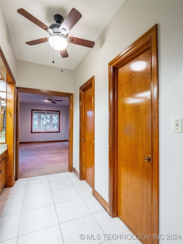 hallway featuring light tile patterned floors