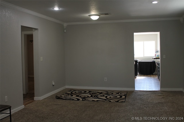 carpeted empty room with ornamental molding