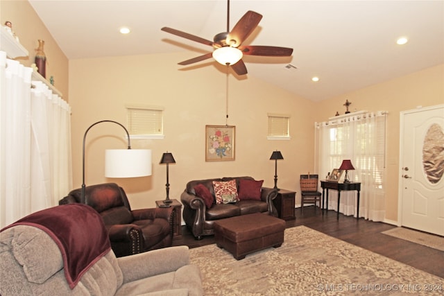 living room with dark wood-type flooring, ceiling fan, and lofted ceiling