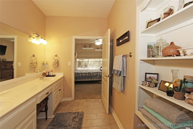 bathroom featuring vanity, ceiling fan, and tile patterned flooring