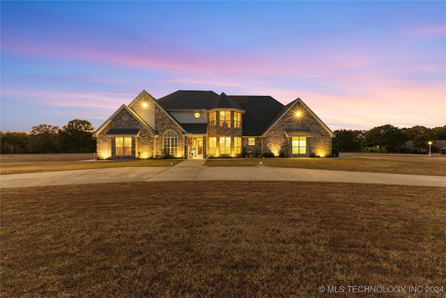 view of front of house with a yard