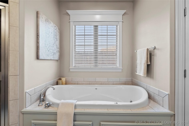 bathroom with tiled bath