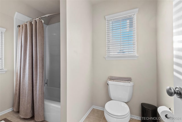 bathroom featuring toilet, tile patterned floors, and shower / bathtub combination with curtain