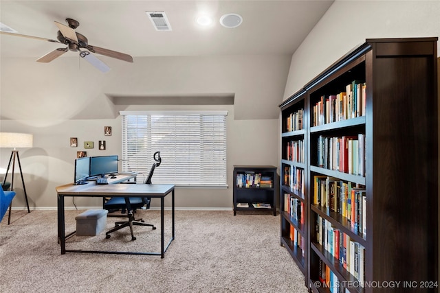 carpeted office space with ceiling fan