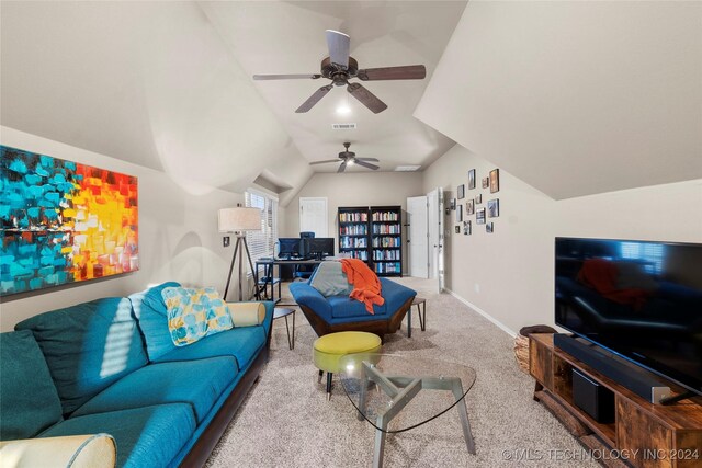 living room with vaulted ceiling and light carpet