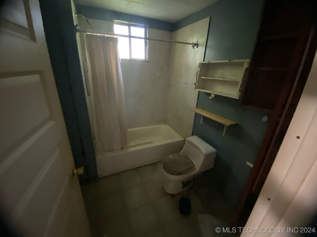 bathroom with toilet and a shower with shower curtain