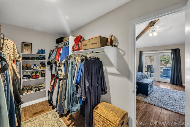 spacious closet featuring hardwood / wood-style flooring, ceiling fan, and french doors