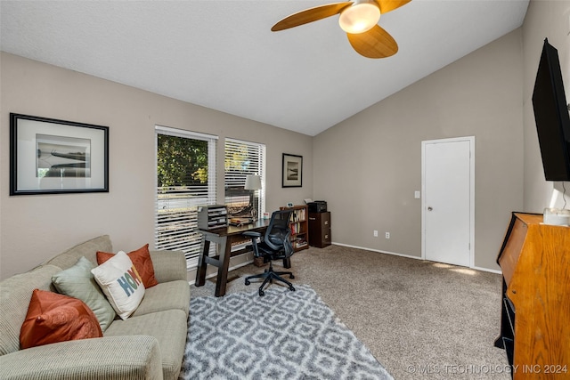 carpeted office featuring ceiling fan and vaulted ceiling