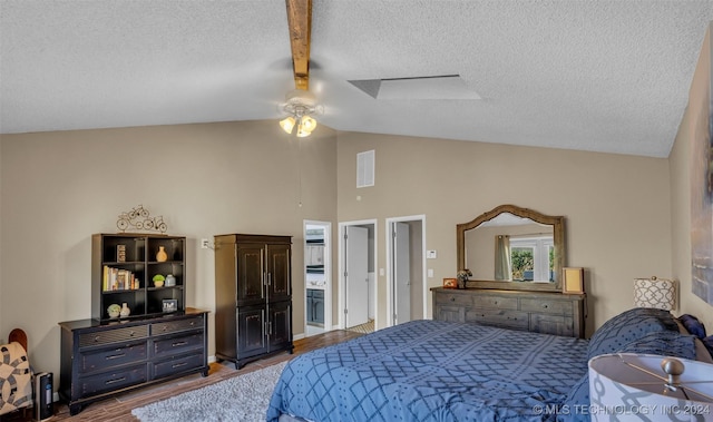 bedroom featuring wood-type flooring, a textured ceiling, vaulted ceiling, and ceiling fan