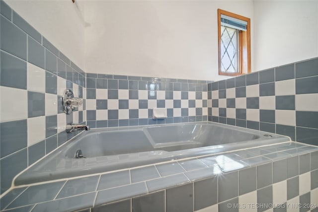 bathroom featuring tiled bath