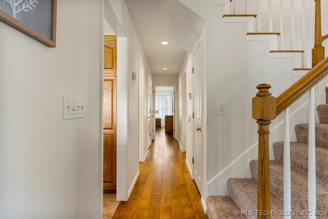 corridor featuring hardwood / wood-style floors