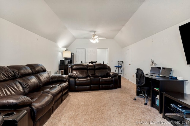 interior space featuring lofted ceiling, light colored carpet, and ceiling fan