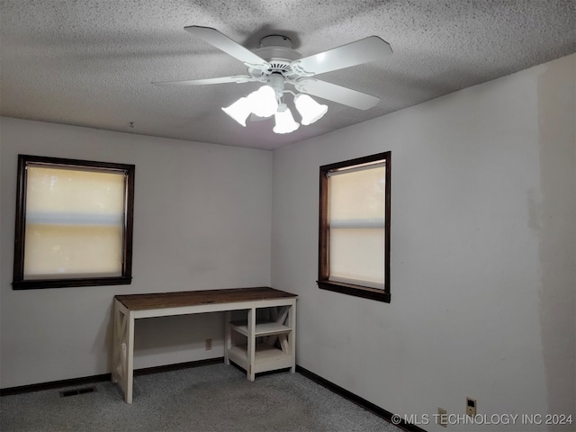 office featuring a textured ceiling and ceiling fan