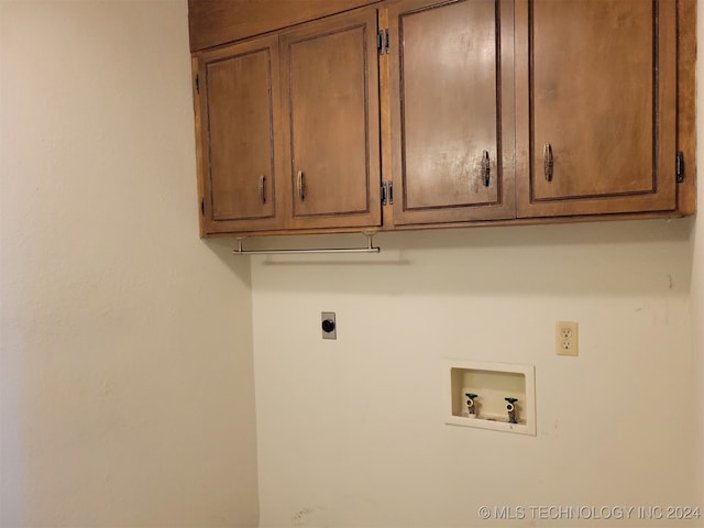 laundry room with cabinets, hookup for a washing machine, and electric dryer hookup