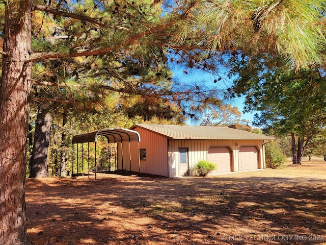 garage featuring a carport