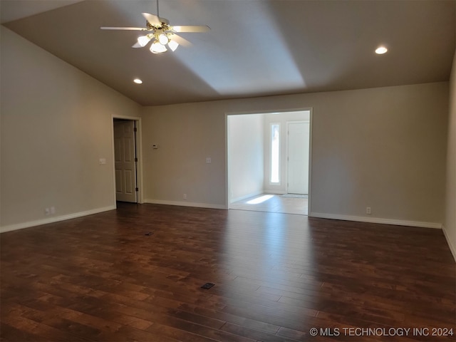 unfurnished room with ceiling fan, dark wood-type flooring, and vaulted ceiling