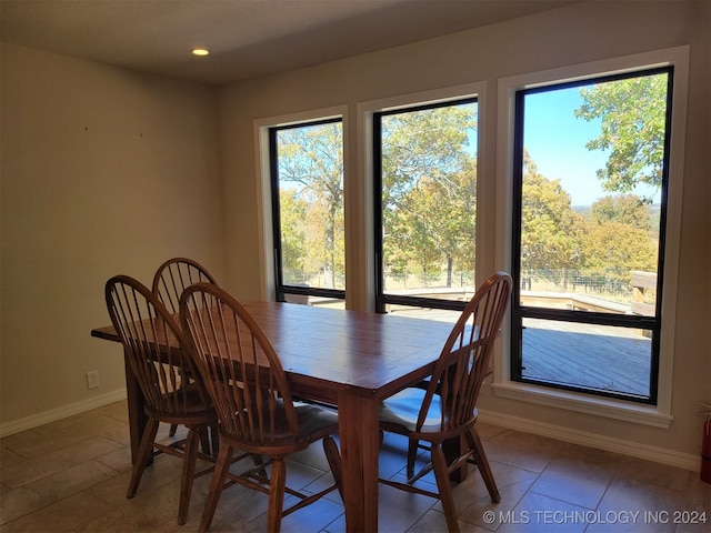 dining area with a healthy amount of sunlight and tile patterned flooring