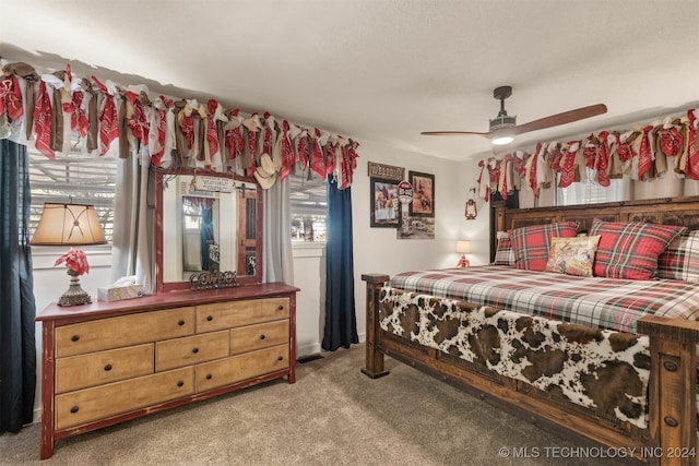 bedroom featuring light colored carpet and ceiling fan